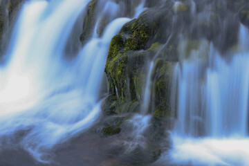 longe exposure image of an icelandic waterfall - obrazy, fototapety, plakaty