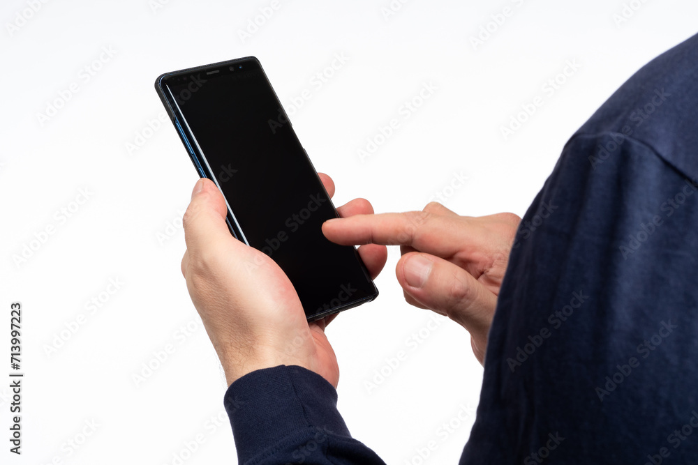 Aufkleber man phone. empty black cellphone in guy hand. man touches screen of mobile phone. place for text on 