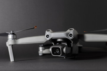 Unfolded professional drone on a gray background
