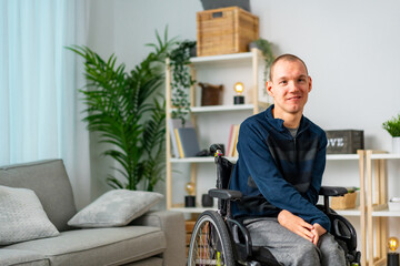 Portrait of a cheerful disabled man chilling at home