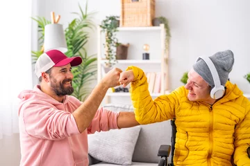 Foto op Canvas Disabled man and friend giving each other a fist bump © unai