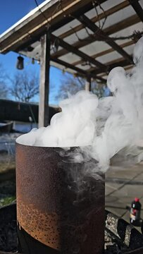 smoke from a barbecue chimney