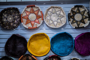 Marrakech, Morocco - March 28, 2022: All kinds of souvenirs exhibited in a shop in the ancient district of Medina in Marrakech.