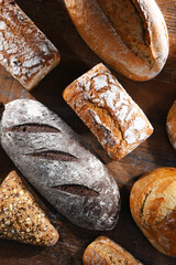 Assorted bakery products including loaves of bread and rolls