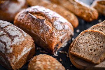 Assorted bakery products including loaves of bread and rolls