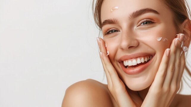 Happy beautiful girl holding her cheeks with a laugh looking to the side. Pretty woman clean fresh skin . Expressive facial expressions .Cosmetology , beauty and Spa