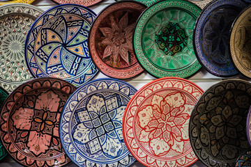 Marrakech, Morocco - March 28, 2022: All kinds of souvenirs exhibited in a shop in the ancient district of Medina in Marrakech.