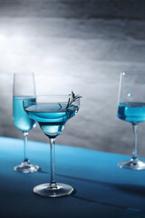 Glasses with blue alcohol cocktail ready for a party	