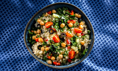 A plate of couscous served with vegetables and chickpeas