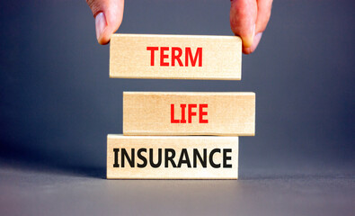 Term life insurance symbol. Concept words Term life insurance on beautiful wooden blocks. Beautiful...