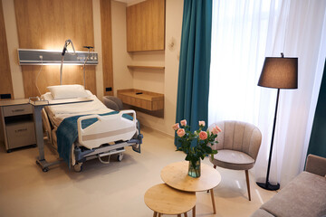 Interior of comfortable medical room with modern furniture in maternity hospital