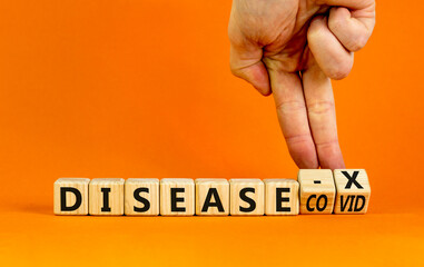 Disease X after covid symbol. Turned cubes and changed the word Disease COVID to Disease X. Beautiful orange table orange background. Doctor hand. Medical, Disease X after covid concept. Copy space.