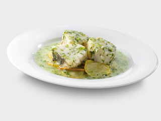 Merluza en salsa verde sobre plato y fondo  blanco. Hake in green sauce on plate and white...