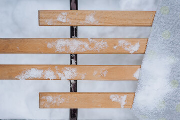 Background, texture of classic sleds made of metal, boards, wood in the snow in winter outdoors. Transport photography close up, leisure concept, top view, sport.