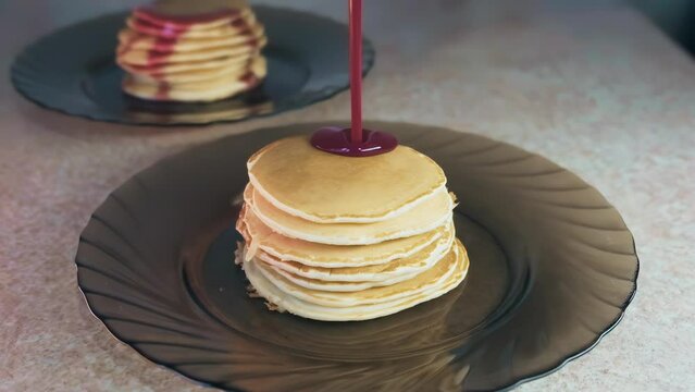 food, jam pours on pancakes, jam flows down a stack of pancakes, a bunch of pancakes, delicious pancakes