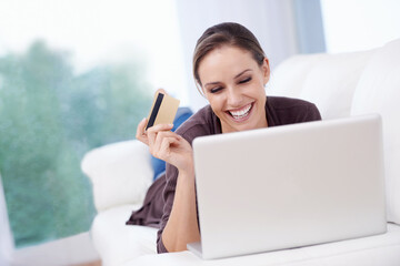 Woman, laptop and credit card on sofa for online shopping, fintech payment and upgrade membership...