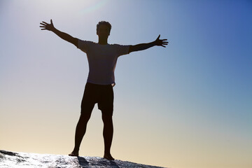 Man, horizon and freedom, blue sky and hiking in nature for adventure and fitness, mockup space and travel. View while trekking, journey and hiker with outdoor view, sun and exercise on mountain