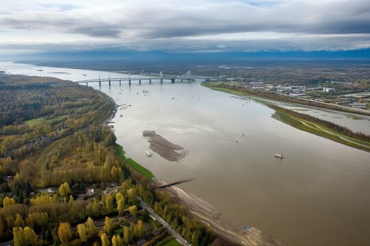 An image showcasing the beautiful scenery of Richmond, BC with the mesmerizing Fraser River. Generative AI