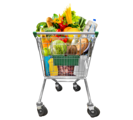 Shopping trolley full of food products and household goods isolated on white.