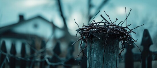 Thorny crown on post near Christian church during Lent