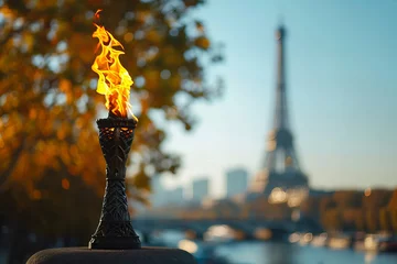  Olympic flame in the background of blurred Eiffel Tower © ALL YOU NEED