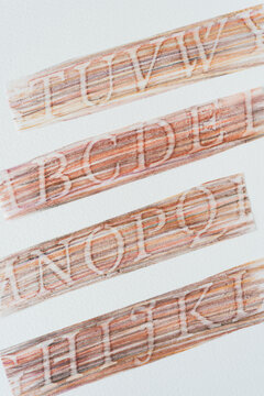 blended color pencil stripes featuring stencil alphabet created via a frottage technique on tracing paper