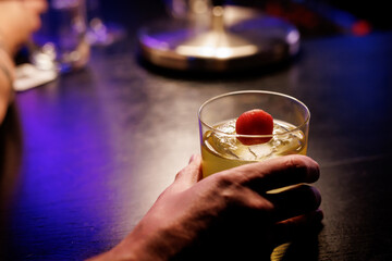 Alcohol cocktail drink in the hand.