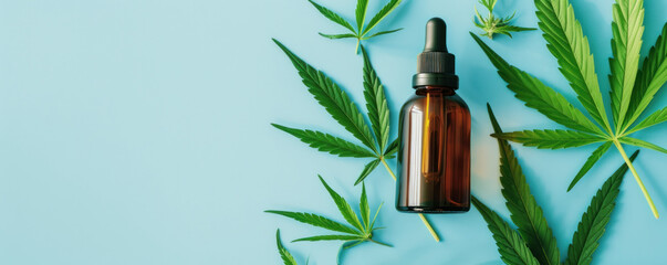 A brown dropper bottle with CBD oil surrounded by green cannabis leaves on a blue background, suggests health, wellness, and natural alternatives in personal care. Banner with copy space.