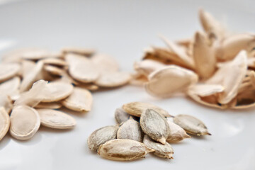 Cleaned and whole pumpkin seeds. Selective focus. Close-up