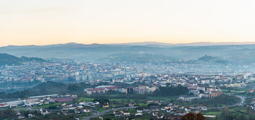 Panorama view of the skyline of the Galician city of Ourense at dusk as seen from the outskirts. - 714069819