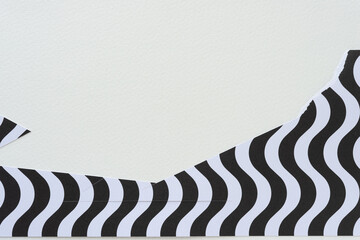 cut paper shape with wavy lines and blank space