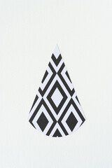 isolated tear-drop paper shape with diamantine black and white pattern
