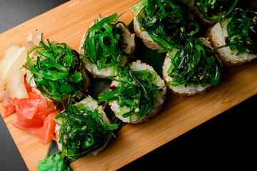 Top view of chuka seaweed evenly adorning a set of rolls