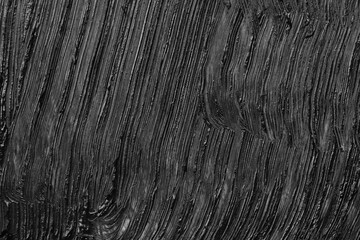 Smear of black mascara as background, closeup