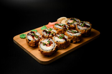 Tasty breaded sushi set with a hint of spice, green onions, and soy sauce