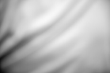 Smooth Silver Waves on Luxurious White Satin Silk: Elegant Texture Background with Grey Metallic...