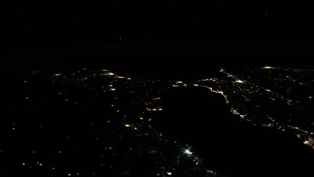 Satellite view city night lights of strait of Gibraltar, mediterranean sea, vertical video animation based on image by Nasa