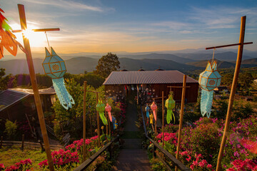 The Northern Coffee Shop is situated atop a hill, with a sunset background, and is decorated with...