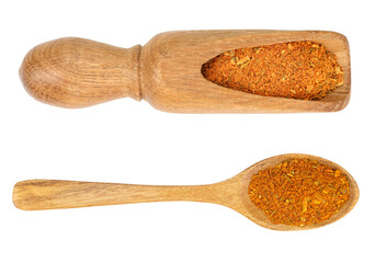 Mixed spices on wooden scoop and spoon isolated on white background. Top view. Flat lay