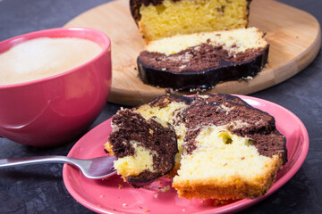 Fresh baked yeast dough with cocoa for different festive occasions, coffee with milk. Delicious dessert