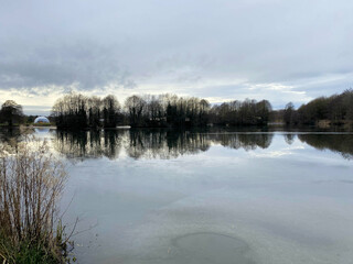 Fototapeta premium A view of Alderford Lake in Shropshire in the winter