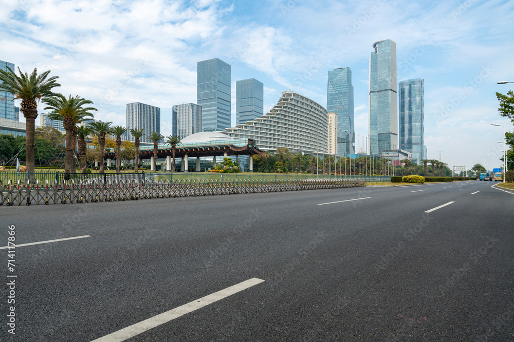 Wall mural car background, empty roads and skyscrapers in the financial district, xiamen, china