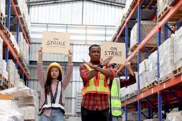 Angry unhappy African worker with colleagues, Asian senior and woman staffs wear safety vest and...