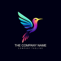 Fototapeta premium A colorful hummingbird logo on a dark background
