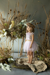 little elf girl in flowers