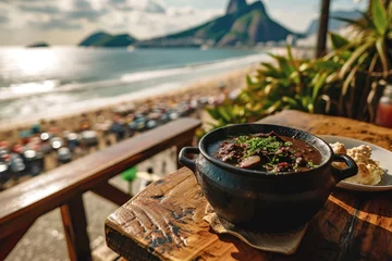 Cercles muraux Copacabana, Rio de Janeiro, Brésil Savoring Brazil: A Plate of Traditional Brazilian Feijoada Takes Center Stage, with the Iconic Copacabana Beach in Rio de Janeiro Providing a Picturesque Backdrop.  