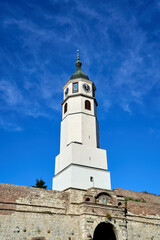 Fototapeta na wymiar Clock tower on a sunny autumn day at Belgrade Fortress in Belgrade, Serbia