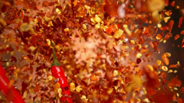 Super Slow Motion Shot of Flying Dry Chilli Peppers. Filmed on High Speed Cinema Camera, 1000fps.