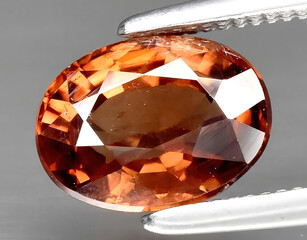 natural brown zircon gem on the background