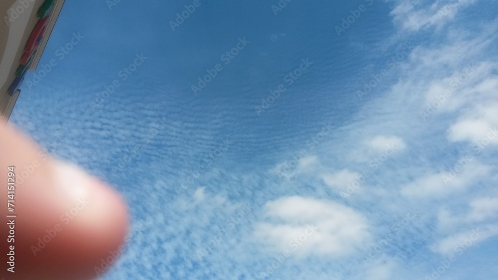 Poster finger and clouds